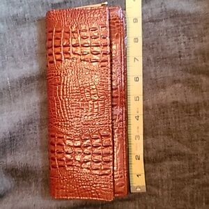 100% Genuine crocodile skin clutch. Vintage with brass detailing.